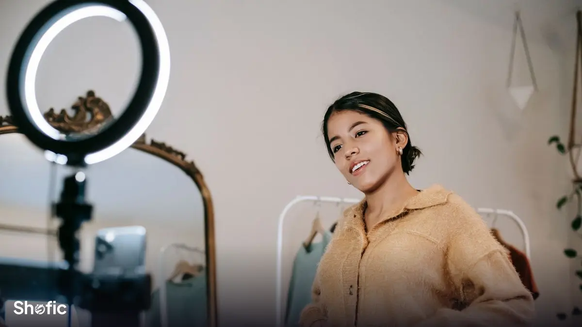 A creator recording a TikTok video under a ring light