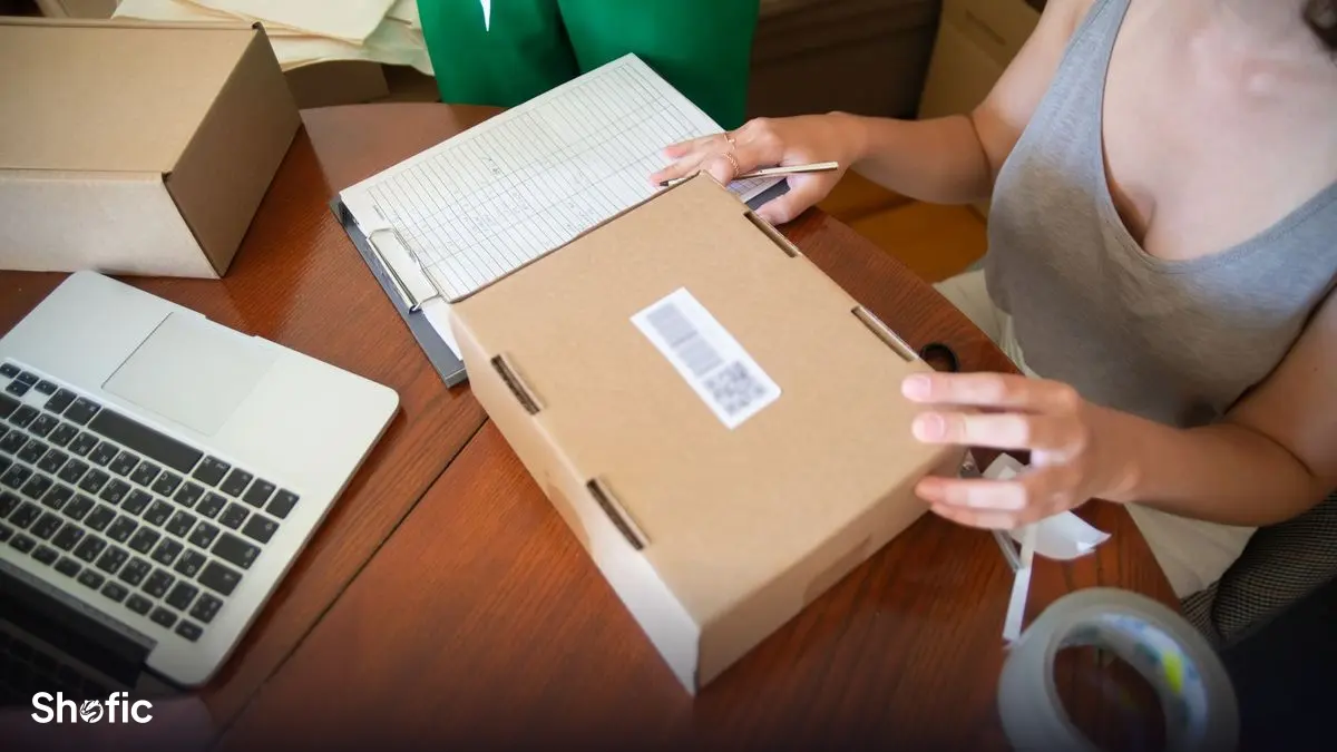 A small business owner packing customer orders