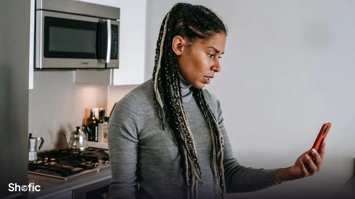 A creator looking at disappointing numbers on a phone