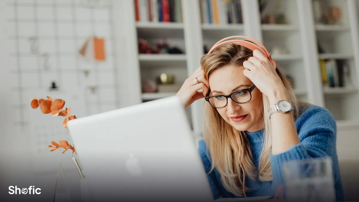 Watching a video on a laptop with headphones
