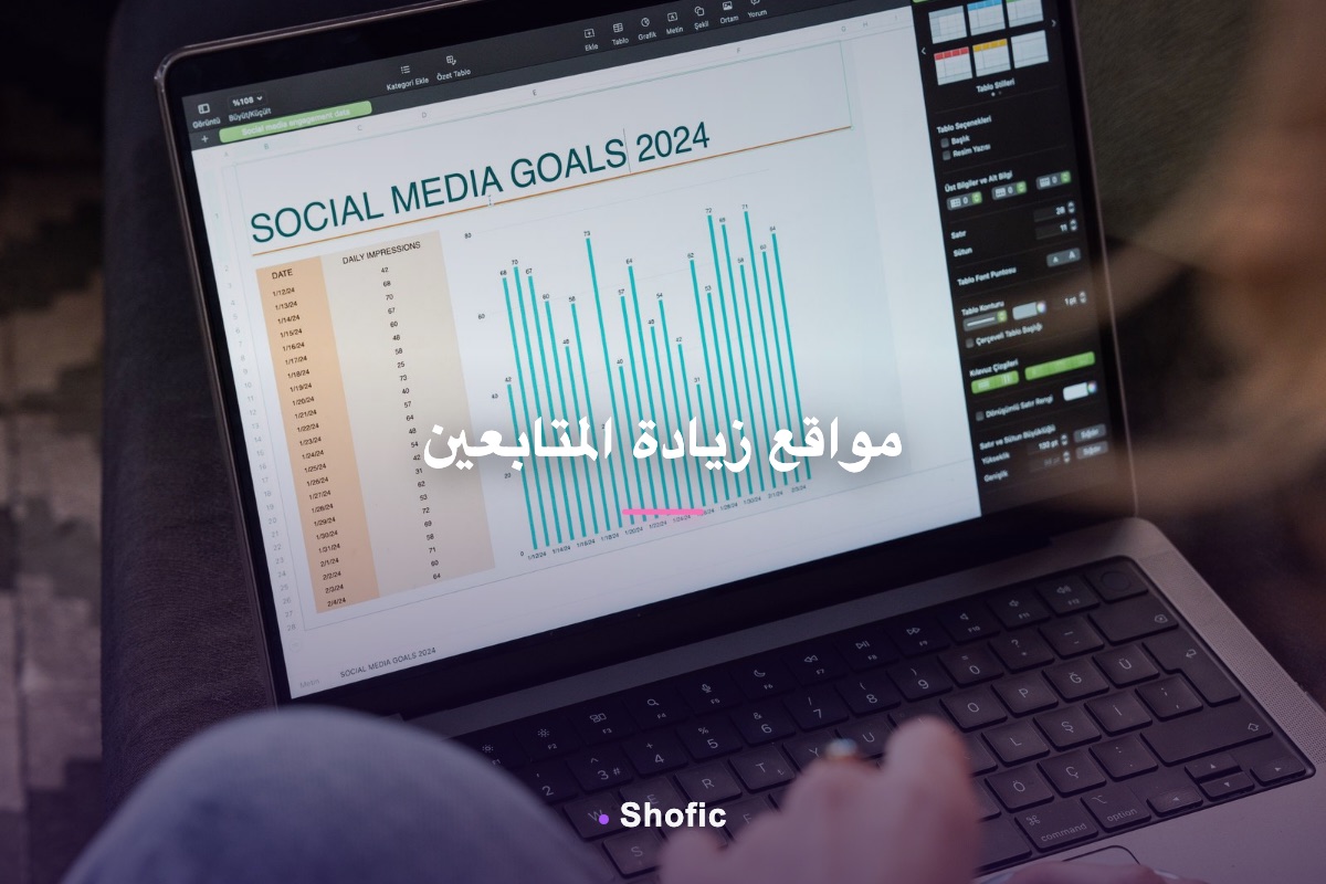 A person reviewing a social media growth chart on a laptop