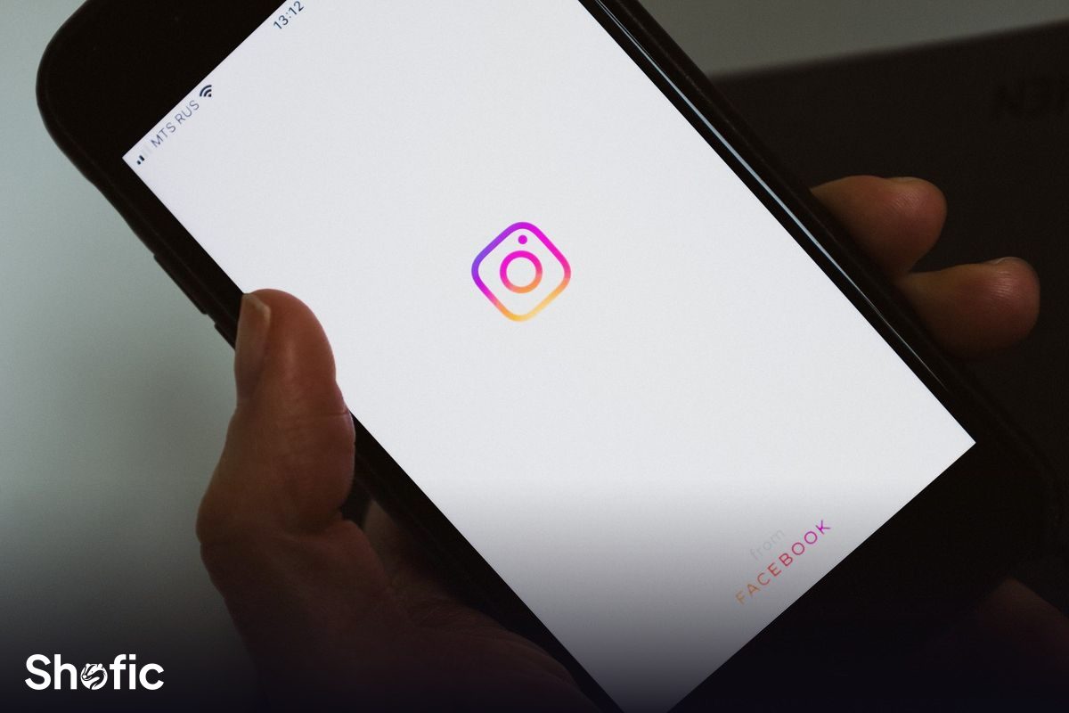 A phone showing the Instagram Explore grid